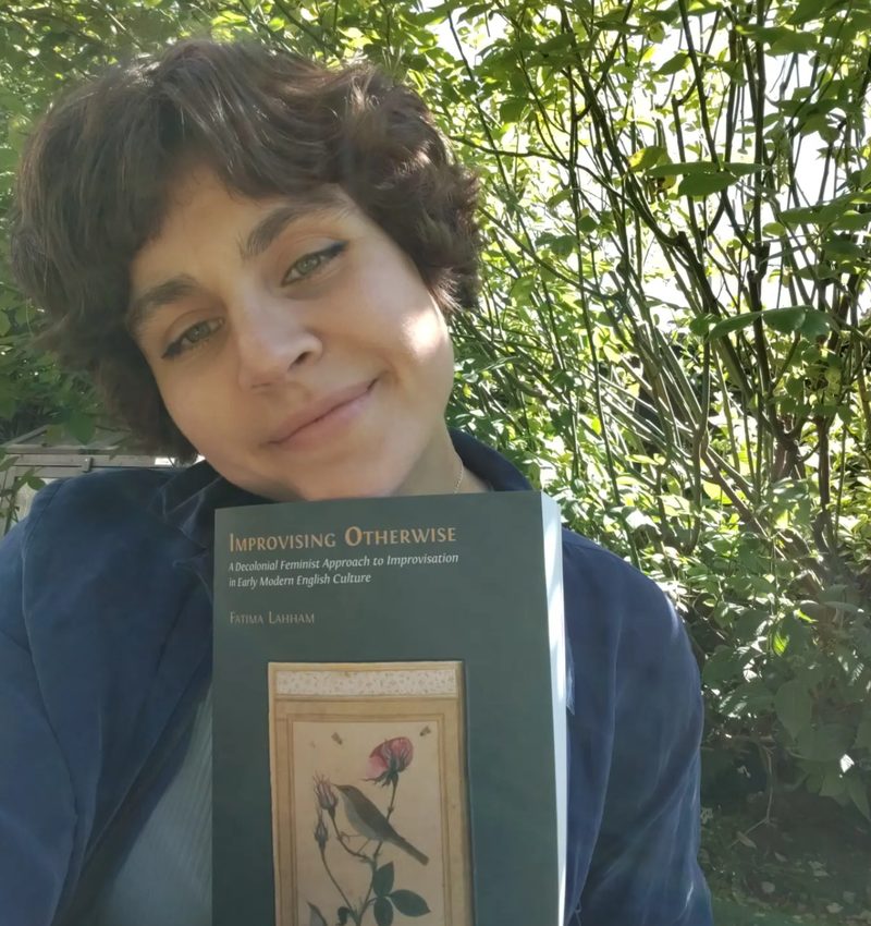 Fatima Lahham holding her book Improvising Otherwise