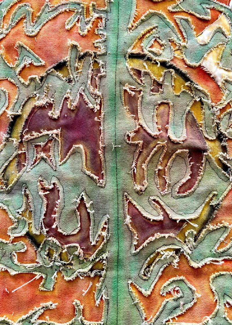 Detail of the heavy cotton canvas work, teal cut-outs on orange