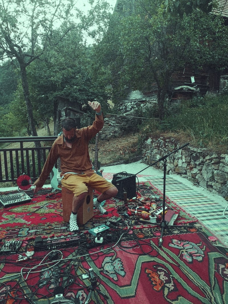 Sлušaliшte concert setup with Bosnian carpets on the terrace